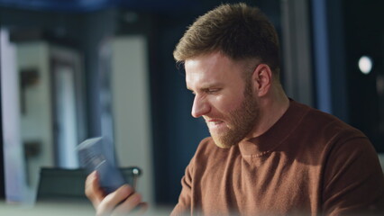 Angry boss shouting smartphone working office closeup. Businessman frustrated