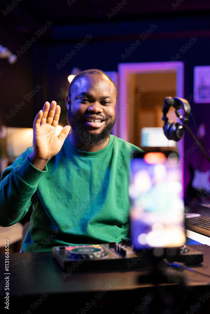 Leinwandbilder Music producer explaining faders and knobs on mixing console before he starts to teach advanced post production stuff. Musical instructor gives advice about acoustical engineering, online vlog.