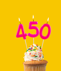 Candles forming the number 450 - Yellow background