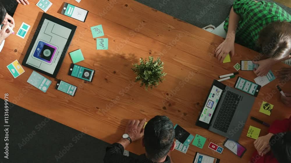 Poster programmer team brainstorm and plan ux ui design for mobile phone while present idea by using laptop