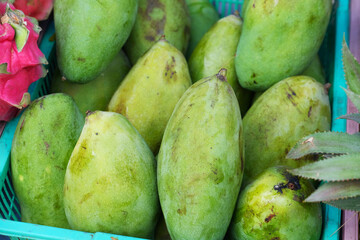Green mango in a market