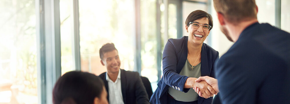 Business, employees or handshake in office with partnership in investment project and funding proposal success. Financial investor, people and shaking hands for b2b negotiation agreement with banner