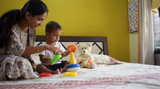 Baby boy toddler kid child son and mother woman playing with toys Colors happy love care learning development growth education home skills sensory organs, School, nursery, playgroup teacher