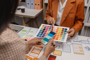 ux developer and ui designer brainstorming about mobile app interface wireframe design in the...