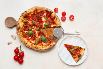 Composition with tasty pizza and cutter on light background