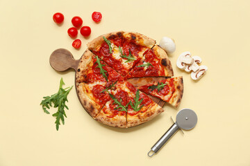 Composition with tasty pizza, ingredients and cutter on beige background