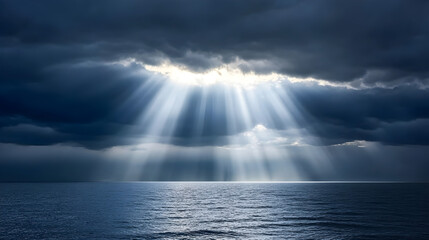 Sun rays breaking through dark storm clouds over the ocean, dramatic weather, hope after the storm
