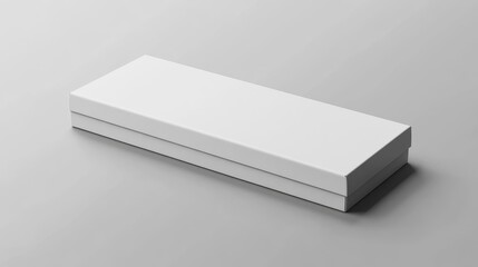 A simple, closed white box on a gray surface, suggesting packaging or storage.