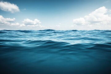 Fototapeta premium Calm ocean waves under a clear blue sky.