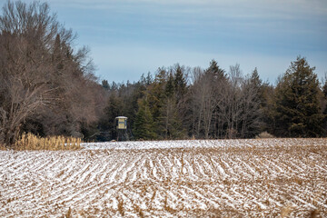 Raised deer blind on Wisconsin farmland with snow