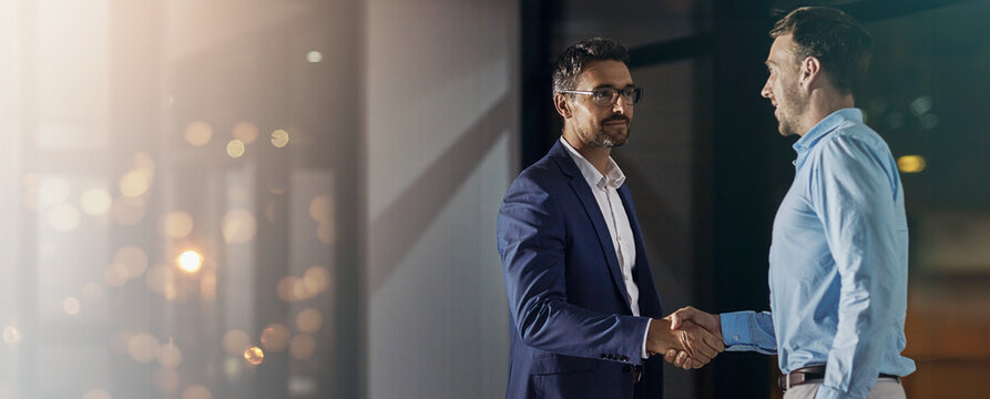 Deal, handshake and partnership with business men in office for meeting, thank you or welcome. Banner, bokeh and mockup with employee people shaking hands for onboarding or recruitment on space