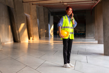 woman engineer with phone on site