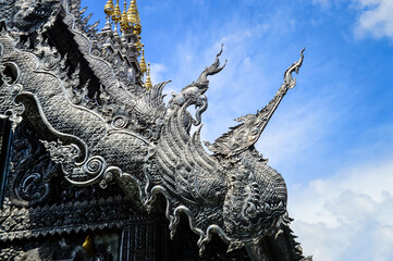 Fototapeta premium Silver Chapel Lanna Architecture at Sri Suphan Temple, Symbols of Buddhism, South East Asia at Chiang Mai, Northern Thailand