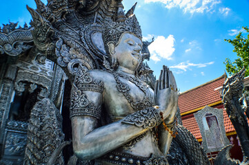 Fototapeta premium Silver Thai Angel Statue Lanna Architecture at Sri Suphan Temple, Symbols of Buddhism, South East Asia at Chiang Mai, Northern Thailand