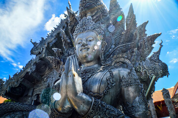Fototapeta premium Silver Thai Angel Statue Lanna Architecture at Sri Suphan Temple, Symbols of Buddhism, South East Asia at Chiang Mai, Northern Thailand