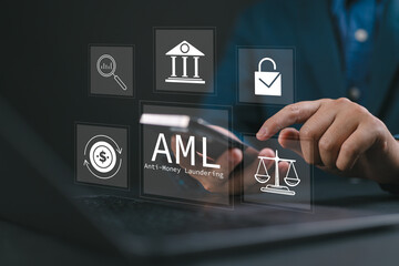 AML : Anti money laundering financial bank concept. Businessman use laptop with virtual AML icon...