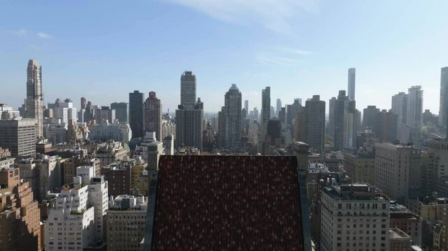 Aerial descending shot of Lenox Hill and the 825 Fifth avenue building in NYC