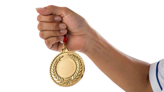 hand holding a gold medal