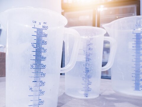 Several measuring cup on the laboratory table.