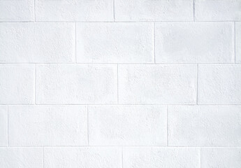 Obraz premium The background image of a white brick wall is arranged beautifully and naturally with space for text insertion.
