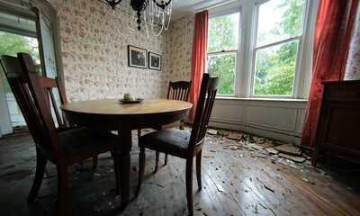 Abandoned dining room with wooden furniture and dusty floor. - Powered by Adobe