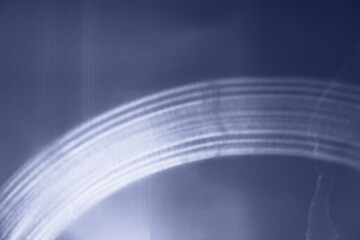 Abstract image with soft-focus dark blue sunlight light patterns as light waves, festive texture...