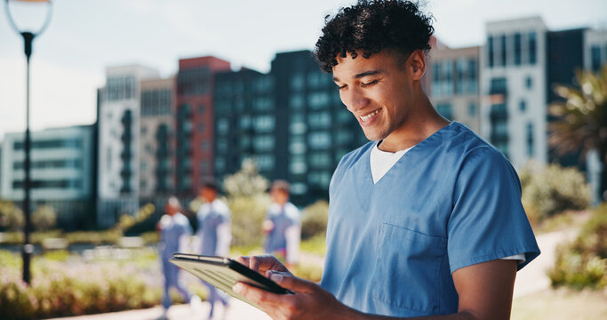 Happy man, nurse and student with tablet for internship, med school or healthcare course at campus. Male person, medical trainee or junior candidate with smile on technology for health study or app