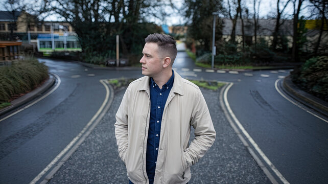 Man Standing at a Crossroads, Deciding Which Path to Take, Decision Making Concept, Two Roads Diverging, Symbolic Choice, Thoughtful Individual Contemplating Direction in Life