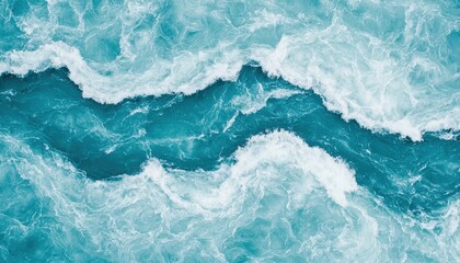 Fototapeta premium Aerial view of vibrant blue ocean waves, creating dynamic patterns through frothy white surf and tranquil turquoise water.