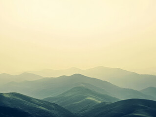 Obraz premium Misty mountains at sunrise casting a tranquil atmosphere in nature's landscape