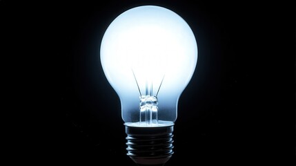 A glowing light bulb with blurred edges, its warm light softly blending into a dark background, creating an inviting atmosphere