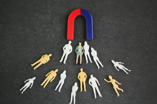 magnets attract customers. Attract leads and customers. Capture Business Candidate With Magnet. Businessman Attracting people Team With Horseshoe Magnet