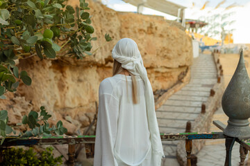 Portrait of a beautiful woman in Arabic clothing in Egypt during sunset.