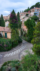 Fototapeta premium Panoramic view of houses and roofs of medieval village of Bormes-les-Mimosas, in the Var, in Provence, France