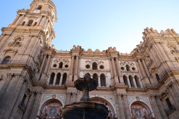 Fountain with the Cathedral of Malaga- Basilica of the Incarnation in the background, Andalusia, Spain  