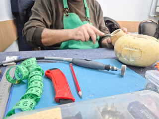 Artist makes mask with water gourd