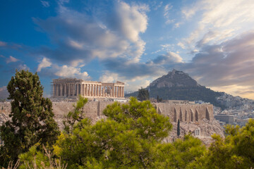 Fototapeta premium Greek Acropolis city of Athens Parthenon symbol of ancient, aerial view. Panorama of residential buildings at sunset summer. World Heritage sites