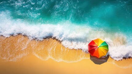 Obraz premium Colorful Beach Umbrella Beside Ocean Waves On Sandy Shore