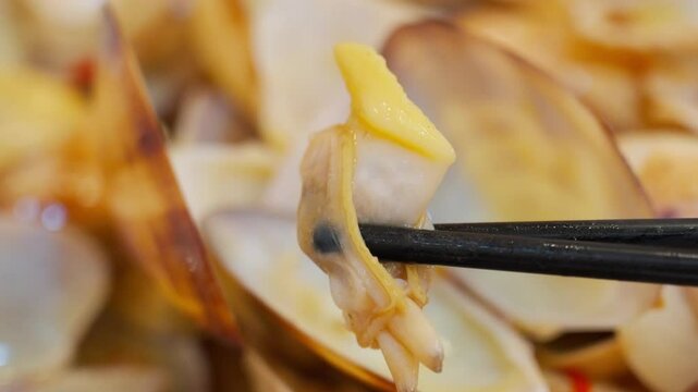 Lala clam stir fry with garlics and chillies close up