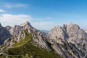 Hiking trail to Gamsova Spica with scenic view of rugged mountain peak Razor and Prisank, wild...