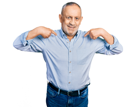 Senior man with grey hair and beard wearing casual blue shirt looking confident with smile on face, pointing oneself with fingers proud and happy.