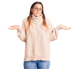 Beautiful caucasian woman wearing wool winter sweater clueless and confused expression with arms and hands raised. doubt concept.