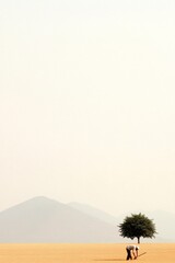 Fototapeta premium Indian Farmer in Minimalist Landscape Under Golden Sky