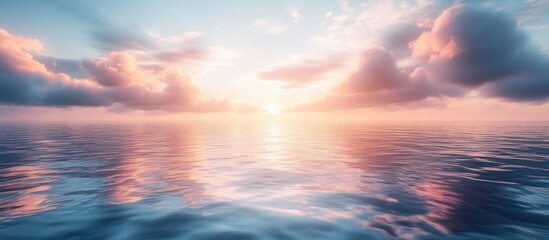 Obraz premium Serene sunset over calm ocean water with pastel clouds reflecting on the surface.