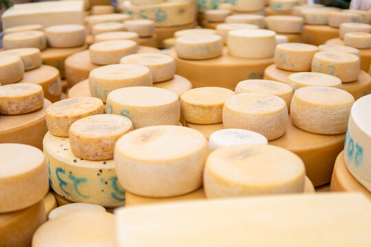 Piles of Swiss cow cheese heads collected during Desalpe festival in Lauterbrunnen, Switzerland