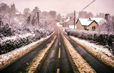 Fototapeta premium Dirty village road in snow winter