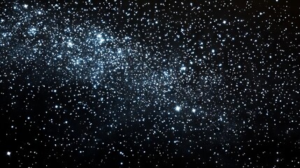 Enchanting night sky filled with sparkling stars illuminating a deep black background, perfect for astronomy, celestial themes, and starry night visuals