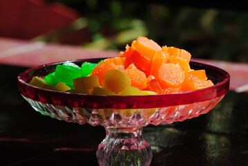 Colorful Fruit Jellies in a Decorative Glass Bowl on a Sunny Day
