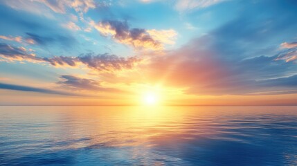 Obraz premium Serene Sunrise Over Calm Ocean Waters with Colorful Clouds