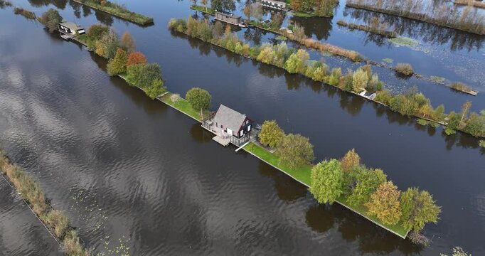 Small houses at the Loosdrechtse Plassen, Scheendijk, marina of Breukelen, The Netherlands, nature reserve with tow holes and legakkers